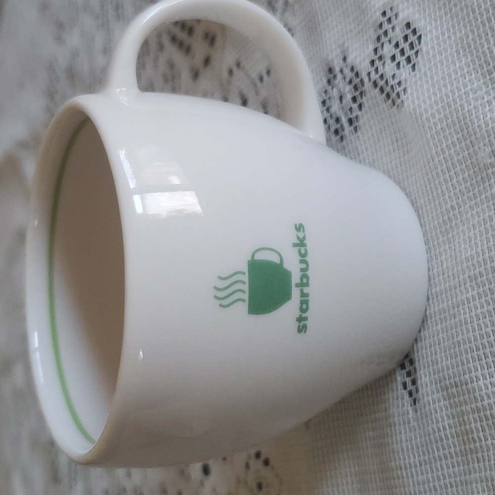 Starbucks espresso cup.  3 inches high.